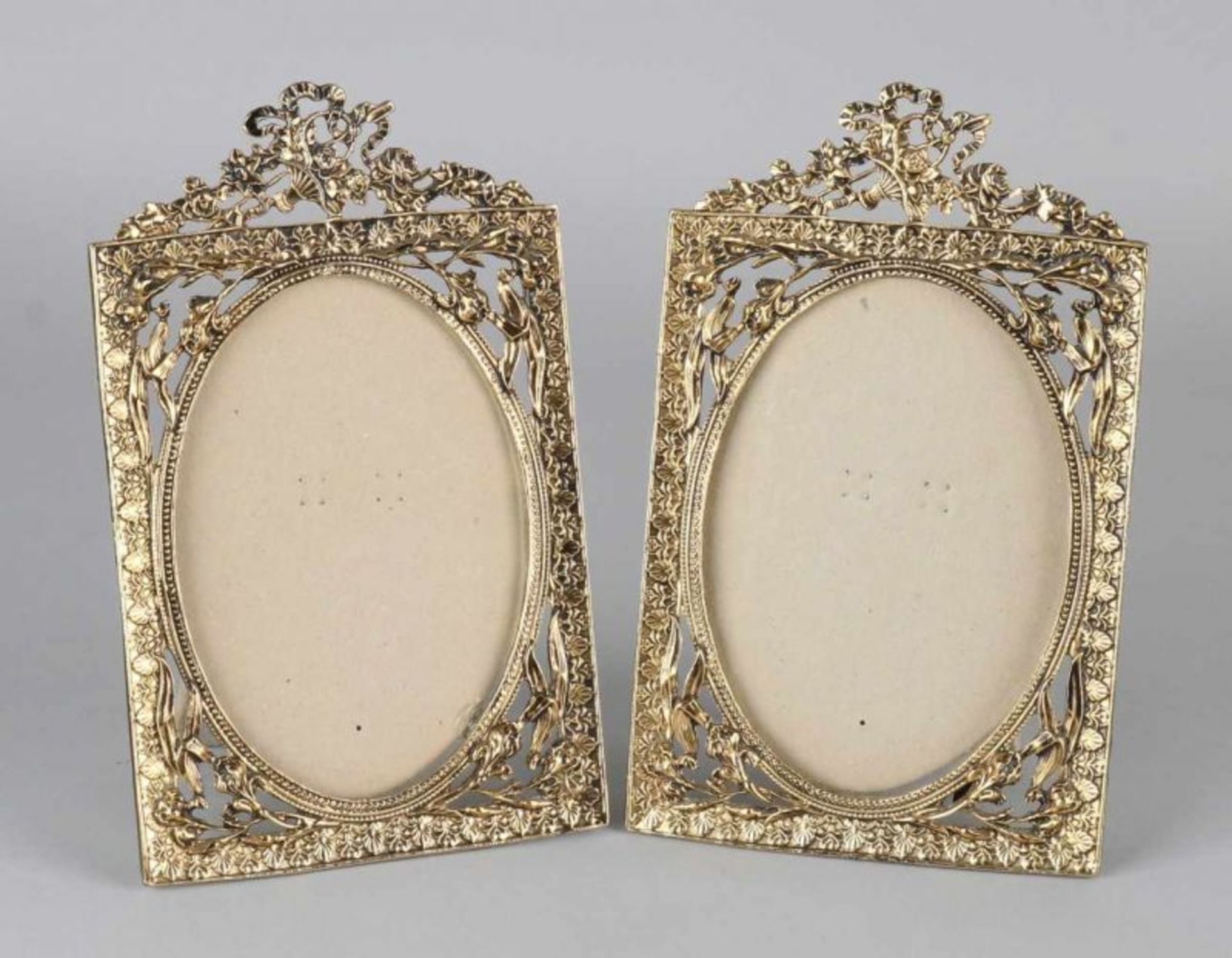 Two decorative brass photo frames in Louis Seize style. 21st century. Size: 18 x 11 cm. In good