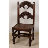 17th Century English wood-stained chair with faces. Size: 103 x 47 x 47 cm. In good condition.