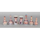 Seven pieces of 19th century Imari porcelain miniature vases with floral decor. Size: 8 - 10 cm.