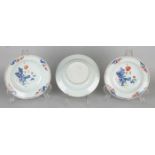 Three times 18th century Chinese Imari porcelain deep plates with garden decor. Two with hairline,