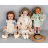 Three antique German dolls. Consisting of: Porcelain doll, Nr. 3200, bellows, hairline neck, with