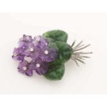 Beautiful white gold brooch, 585/000, with precious stones. Brooch in the form of a bouquet of