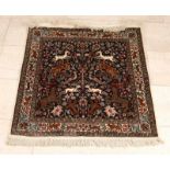 Old Persian rug with floral and animal decor. Size: 104 x 89 cm. In good condition. Alter