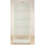 Modern white display cabinet with lighting and three glass shelves. Four sides are provided with