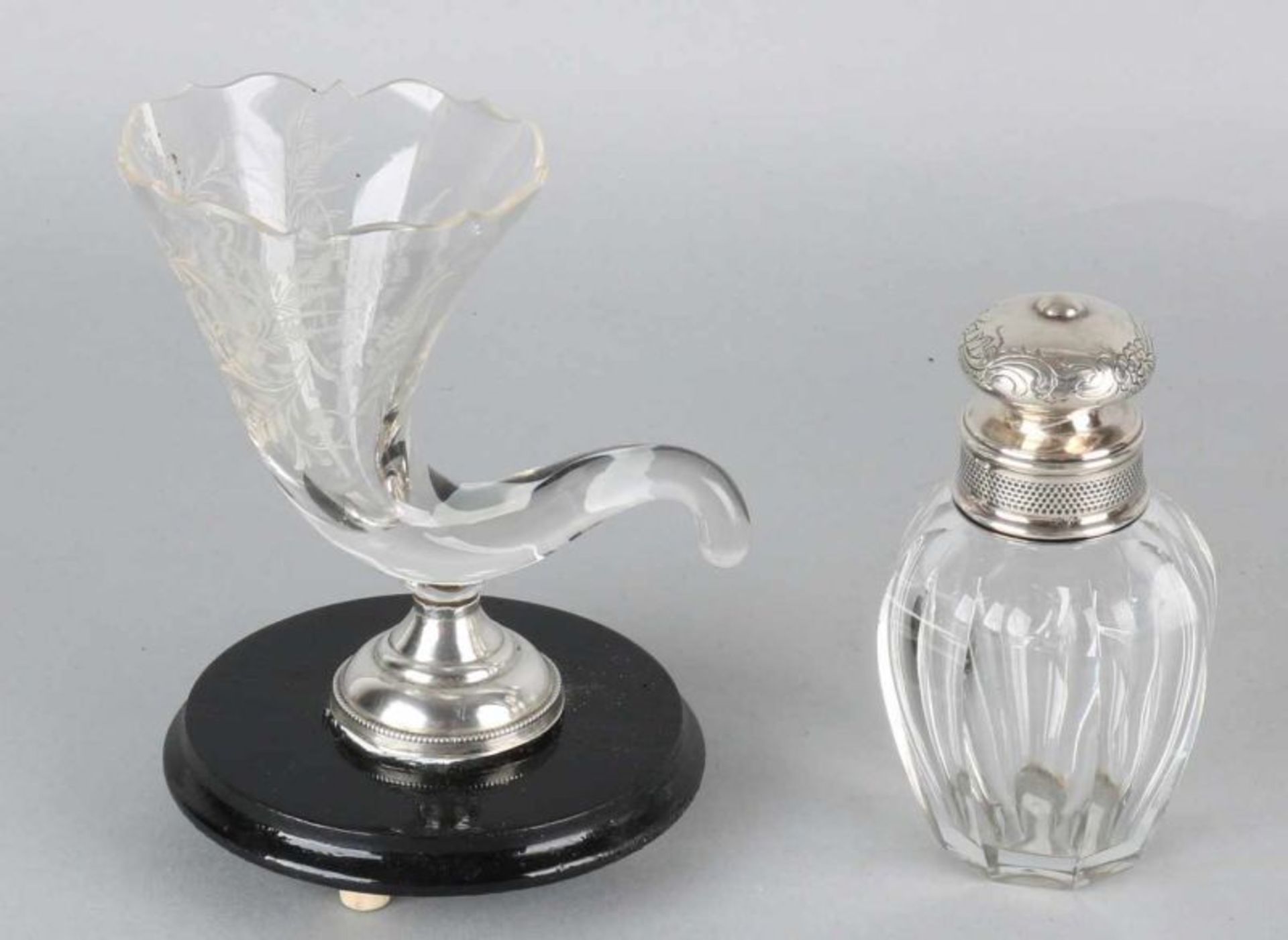 Two parts crystal with silver, 835/000, a cornucopia with etching, on silver round base with