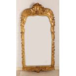 Early 19th century gilded mirror in Rococco style. Size: 110 x 53 cm. In very good condition.