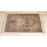 Old Persian rug. Cashmere silk. With floral decor. Size: 76 x 146 cm. In good condition. Alter