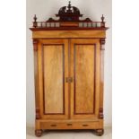 Walnut two-door wardrobe. Underneath two drawers with one drawer and several shelves. On top of a