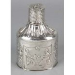 Antique silver tea caddy with passionate floral images and tea-drinking gentleman and lady. Lid with