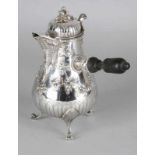 Silver jug, 950/000, in Louis XVI style, decorated with bows and flowers. placed on 3 curling legs