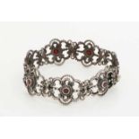 Silver bracelet, 835/000, with flower links made of volutes decorated with a small round faceted