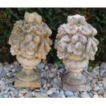 Two large concrete garden ornaments with fruit. 20th century. Size: 65 x 35 cm ø. In good condition.