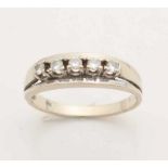 White gold ring, 585/000, with diamonds. A riding ring with a high row of chatons with 5 brilliant