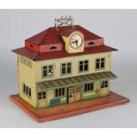 Antique German tin toy station. Signed Foreign. Circa 1930. Size: 21 x 24 x 17 cm. In reasonable /