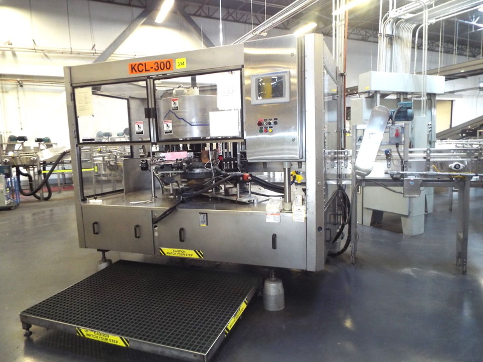 Krones/K2 Wraparound Canmatic 24 Station Cut and Stack Hot Melt Labeler, Upgrades to Non-Contact