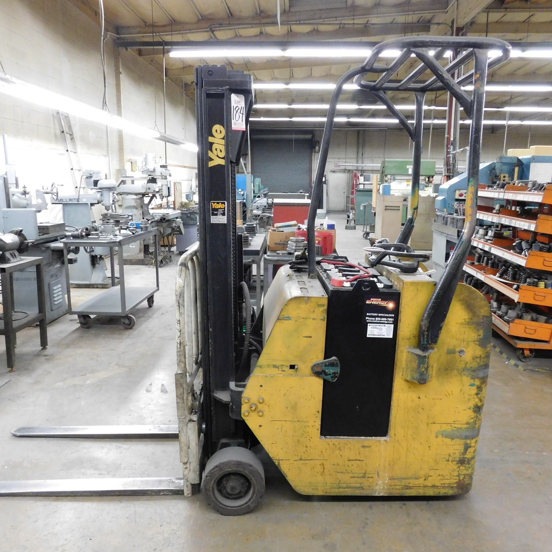 YALE STAND-UP ELECTRIC FORKLIFT, 2000 LB CAPACITY, MODEL ESC20G4T083, S/N 219917, W/ EXIDE CHARGER