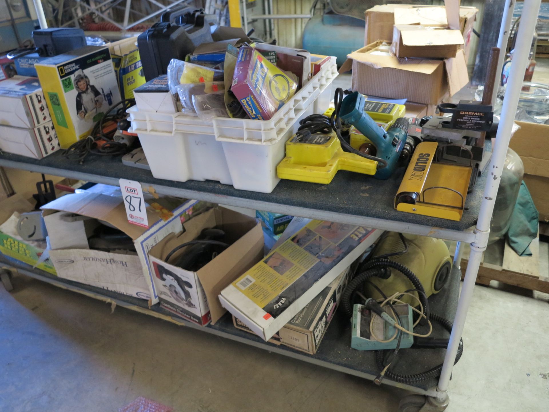 LOT - CONTENTS OF (2) LOWER SHELVES: STUD WELDER, VACUUM PUMP, DRILL, SAW, HOSE REELS