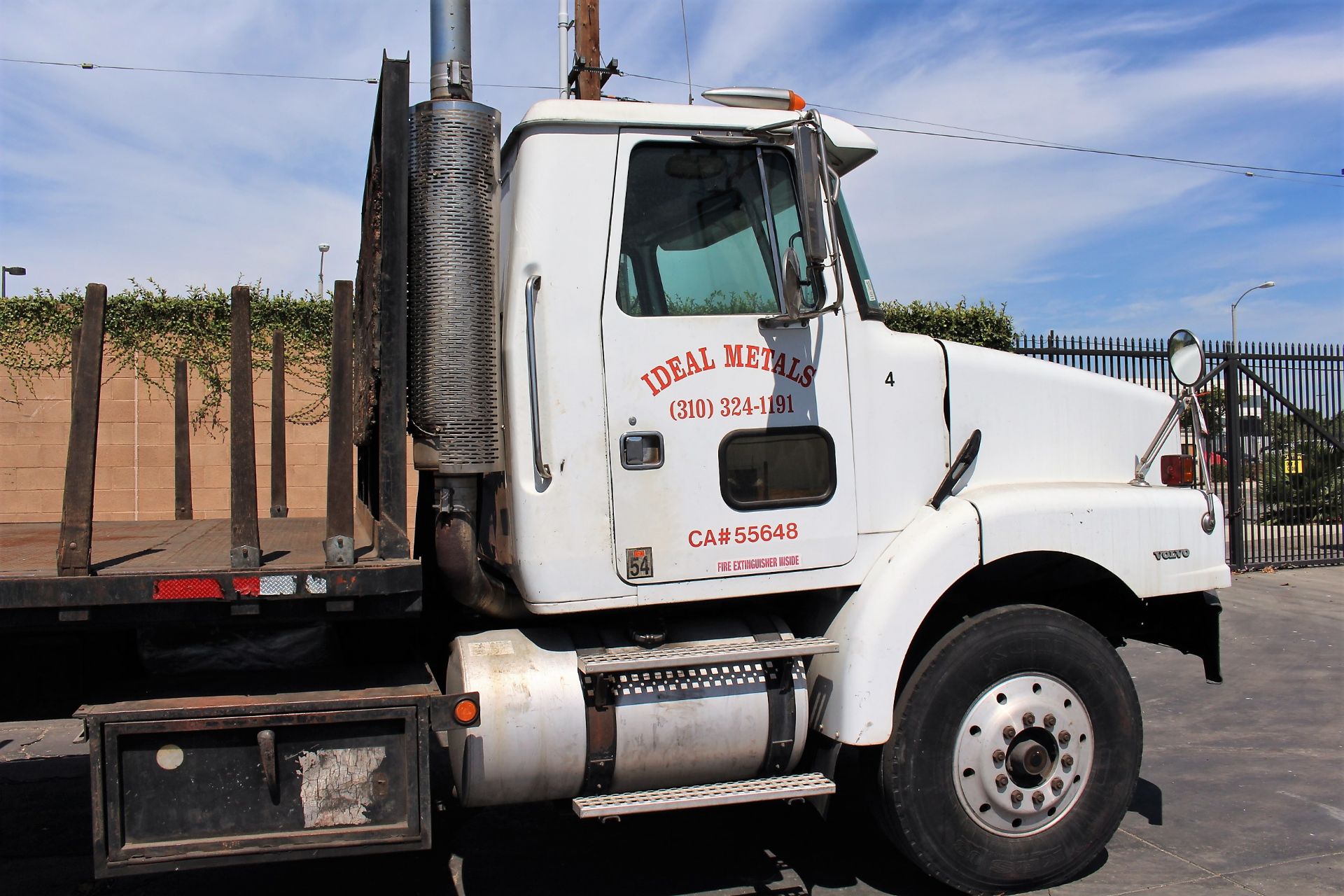 1996 VOLVO STAKE BED TRUCK, 24’ BED, CUMMINGS 94 M11-330E DIESEL ENGINE, ONLY 128,612 MILES