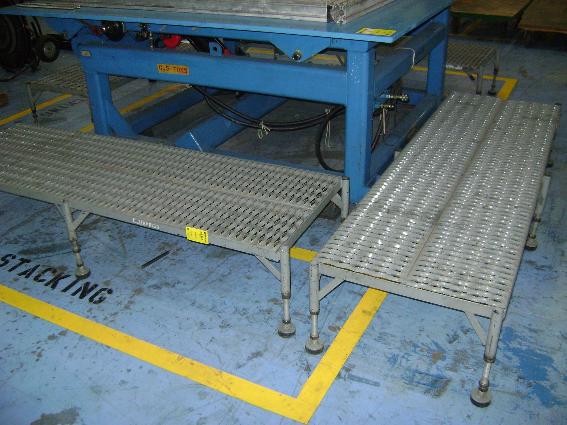 Hydraulic Stacking Lift Table 12,000# Cap 68" X 70" o/s max core dim w/grey walking platforms.