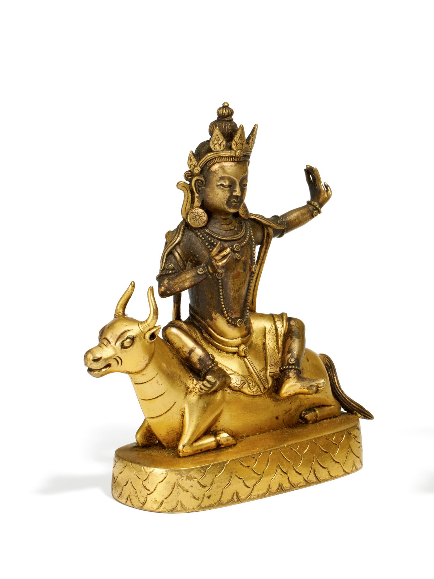 BODHISATTVA AUF OCHSE. Sino-tibetisch. 18./19. Jh. Bronze, fein graviert und feuervergoldet.