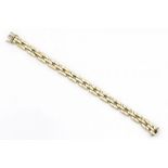 14 krt. gouden schakelarmband, lengte: 19 cm., breed: 8 mm., gewicht: 19,5 gram