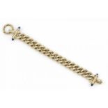 18 krt. gouden schakelarmband, aan de uiteinden bezet met blauwe saffieren, lengte: 19,5 cm.,