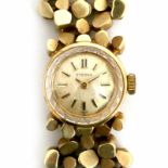 A 14 krt yellow gold ladies' wrist watch. Quartz. Brand Eterna, Ref. 55087563. With a 14 krt yellow