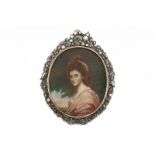 A rose and yellow gold miniature portrait frame and pendant. Rim is decorated with a bow, birds and