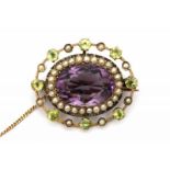 A below Dutch standard rose gold Suffragette brooch. Set with amethyst, split pearls and peridots.