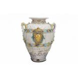 A large continental majolica waterpot, the front decorated with armorial crest. 19th century.