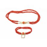 Two row precious coral necklace and matching bracelet. With 14 krt yellow gold locks set with a