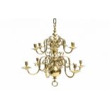 A Dutch brass chandelier with twelve arms in two tiers. 18th century. Hoogte 63 cm. 29.00 % buyer's