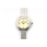 A 18 krt white gold ladies' wrist watch. Manual winding. Brand Corum. Plexiglass. Dial with four