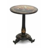 A black lacquer wine table 'gueridon' with a foldable top. Circa 1800. Diameter 57 cm. 29.00 %