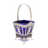 A German silver basket. With a blue glass liner. 20th century. Hoogte 20,5 cm. 29.00 % buyer's