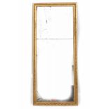A mirror in two parts. In a gilded wooden frame. 19th century. 189 x 82 cm. 29.00 % buyer's premium