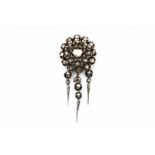 A silver brooch with three detachable pampels. Set with rose cut diamonds. Mid 19th century. Can