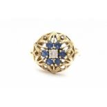 A 14 krt yellow gold ring with stylised leaves. Set with six facetted sapphires, total ca 0.45 ct