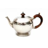 An English silver teapot. Maker's mark C.S. Harris & Sons Ltd., London. Hallmarked 1910-1911.