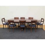 A mahogany dining table, with eight chairs. With three extra leaves. Early 20th century. Diameter