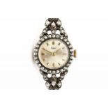 A 14 krt yellow gold and sterling silver ladies' wrist watch. Manual winding. Brand Sagit. Partly