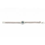 A white gold chevron link bracelet. Set with a sapphire, ca. 1.50 ct, and 15 diamonds, total ca. 0.