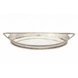 An oval silver tray. Maker's mark Jacobus P. van den Berg, 's-Gravenhage. Dated 1917. Retailer: