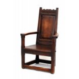 An elm panel-back chair. 18th/19th century. Hoogte 111 cm. 29.00 % buyer's premium on the hammer