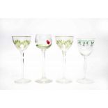 Jugendstil Four high stemmed wine glasses of which two with green decorated engraved floral pattern