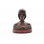 Emmanuel Villanis (1858-1914) A patinated bronze bust, on red stone base, Tête de Lys, with