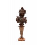 Art Nouveau A patinated bronze buste of a woman with hat and sleeve, on high metal base, circa