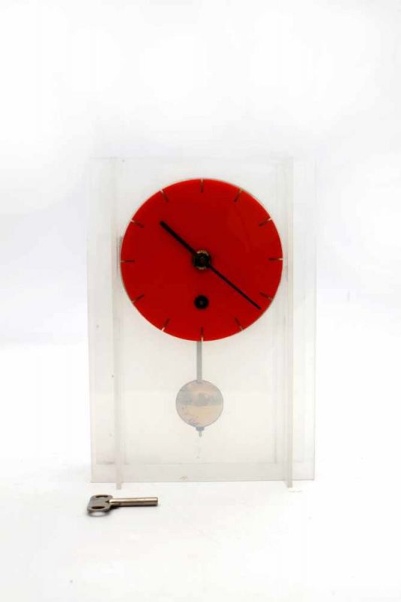 Sixties A lucite table clock, with key and pendulum, purchased at Studio 40, The Hague. 24,5 cm. h.