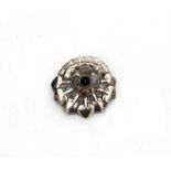 Georg Jensen (1866-1935) A hammered silver brooch with rock crystal and granate, floral design,