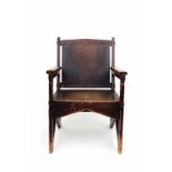 Nieuwe Kunst An ebonised deal armchair with sloping backrest, in the style of H.P. Berlage and A.J.